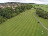 field showing lawn stripes during grass cutting in sheffield