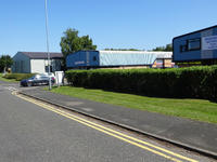 industrial estate with freshly cut hedge