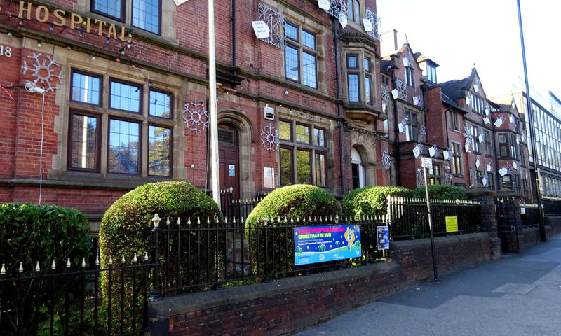 front of Sheffield Children's Hospital with freshly pruned shrubs